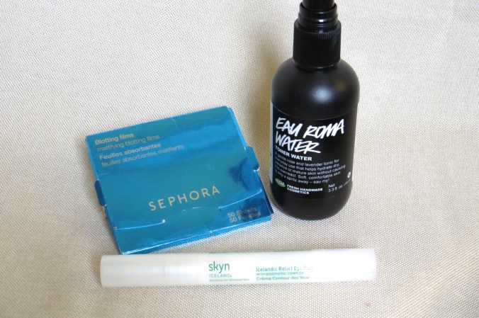 Pack these for midday emergencies: Sephora Blotting Films for inevitable afternoon sweatiness, Lush Eau Roma water to rehydrate, soothe, and perk you back up, and Skyn Iceland Icelandic Relief Eye Pen to keep puffy, tired eyes from reemerging.